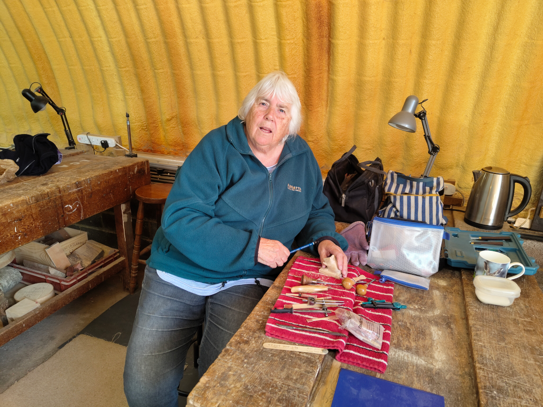 Ann carving a mouse