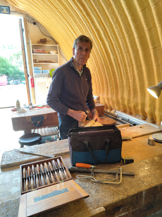 John carving a yacht
